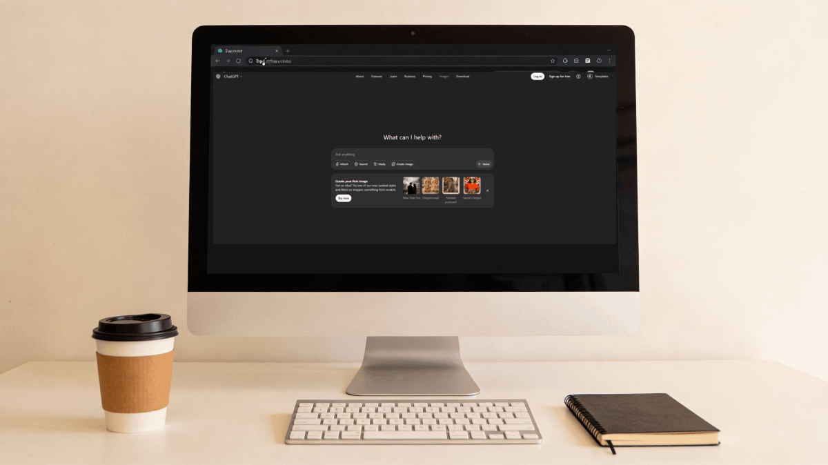 Modern desktop setup showing ChatGPT interface open on computer screen with coffee cup